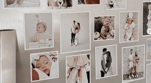 A fridge covered in customer photo magnets
